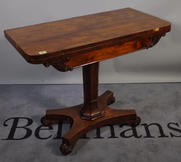 A 19th century rosewood rectangular foldover tea table, with turned column and quatrefoil base, 91cm wide x 74cm high.