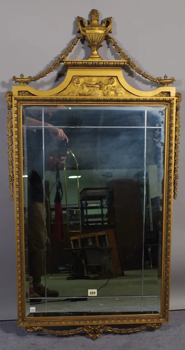 An 18th century style gilt framed wall mirror, with urn and swag surmount, 56cm wide x 114cm high.