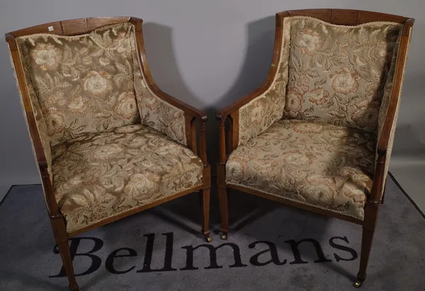 A pair of Edwardian mahogany line inlaid upholstered square back armchairs, 57cm wide x 89cm high, (2).