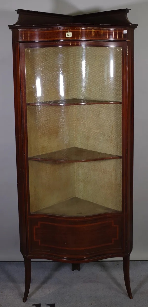 An Edwardian mahogany satinwood banded serpentine fronted glass corner display cabinet, 72cm wide x 172cm high.