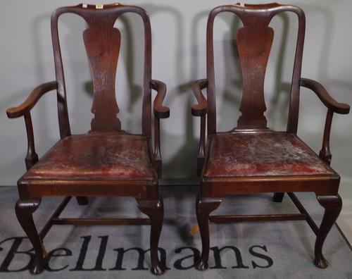 A set of ten Queen Anne style mahogany vase back dining chairs to include two carvers, (10).