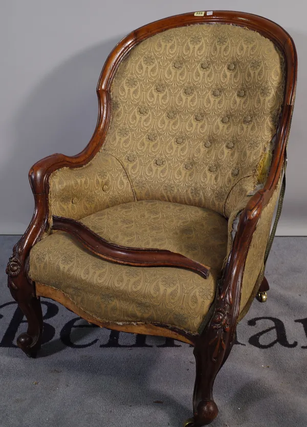 A Victorian mahogany button upholstered armchair on squat cabriole supports, 68cm x 112cm high.