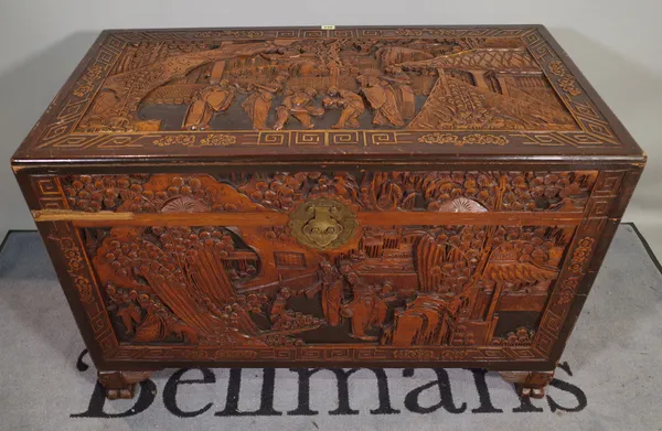 A 20th century Chinese carved hardwood trunk, 110cm wide x 70cm high, (a.f.).