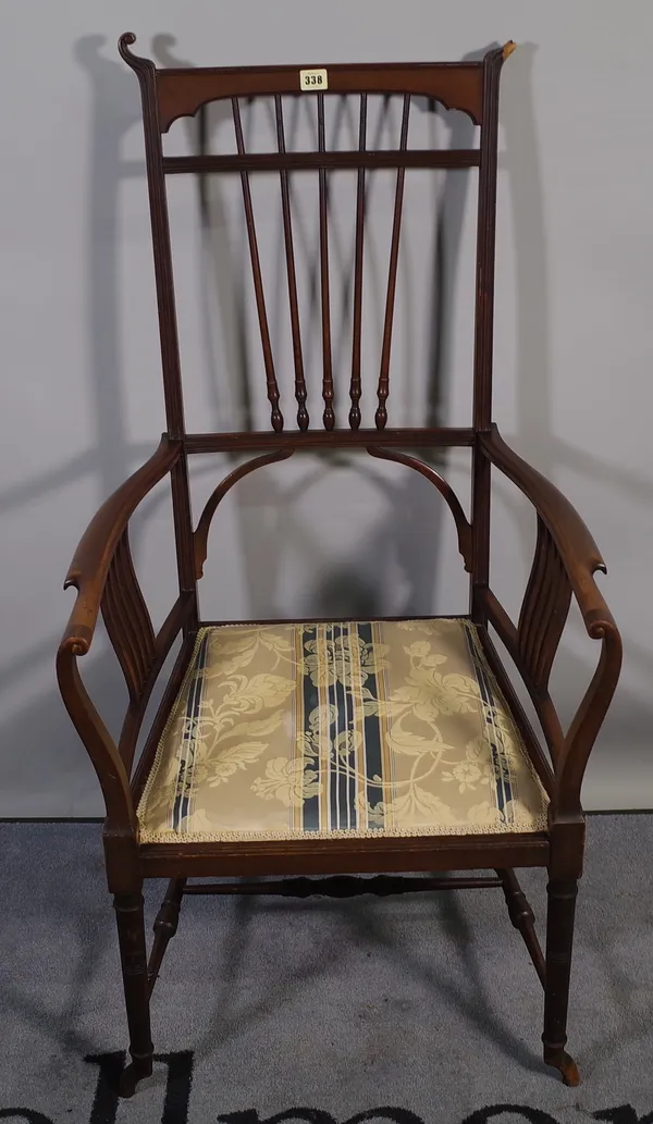 An Art Nouveau style mahogany stick back open armchair, 57cm wide x 110cm high.