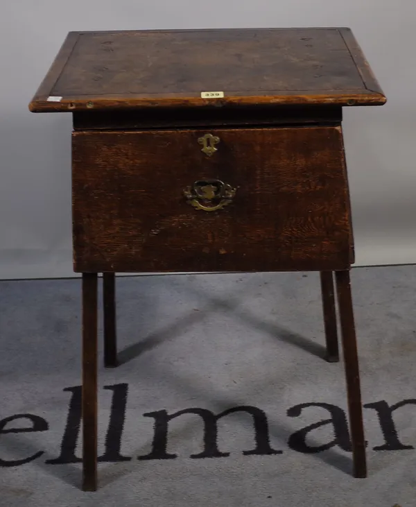 An 18th century and later oak single drawers side table of tapering form on square supports, 48cm wide x 72cm high.