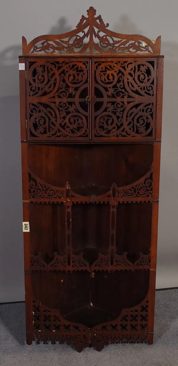 An 18th century style hanging corner cupboard with fret work decoration, 41cm wide x 96cm high.