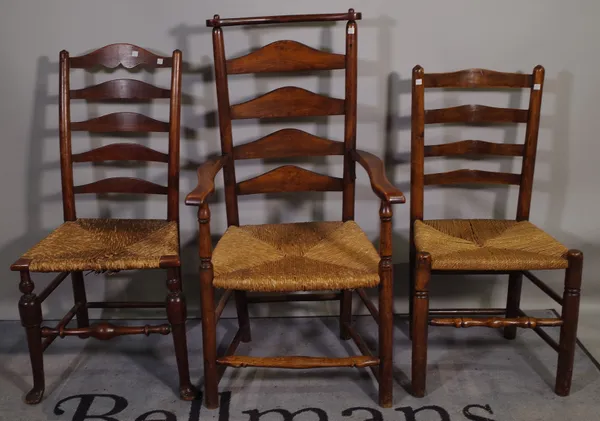 A matched set of nine oak Lancashire ladder back dining chairs to include one carver, (9).