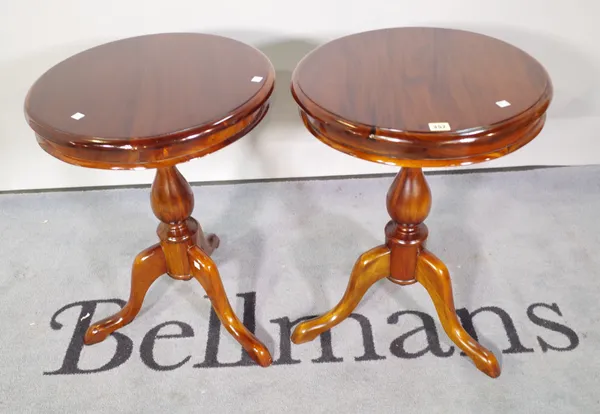 A pair of 20th century mahogany circular side tables, 48cm diameter x 64cm high, (2).