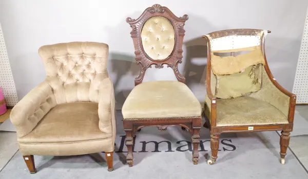 A late Victorian mahogany framed low armchair on tapering square supports, a Regency mahogany tub chair and a late Victorian oak carved back dining ch