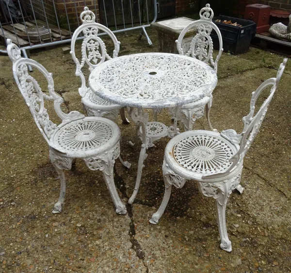 A 20th century white painted metal garden table, 69cm wide x 68cm high and a set of four 20th century white metal garden chairs, (5).