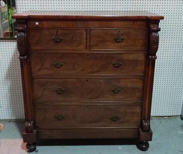 A Victorian mahogany chest of two short and three long graduated drawers on tapering bun feet, 117cm wide x 127cm high.