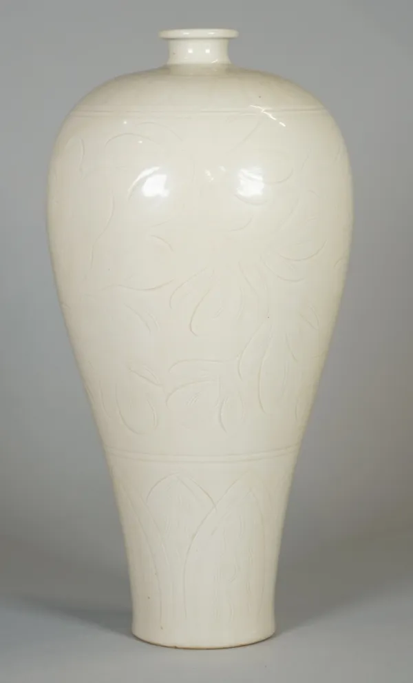 Asian interest; a Song style ivory glazed porcelain Meiping, incised with flowers above a band of overlapping leaves, 30cm. high.
