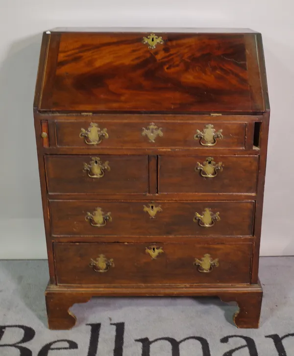 A 19th century mahogany bureau with two short and two long drawers on bracket feet, 70cm wide x 97cm high.