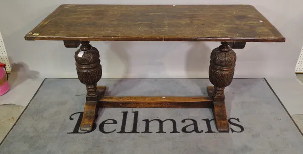 An 18th century oak refectory table on bulbous supports, 147cm long x 76cm high.