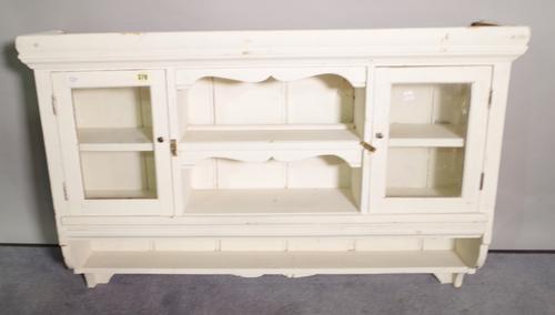 An early 20th century white painted pine hanging cupboard, 96cm wide x 65cm high.