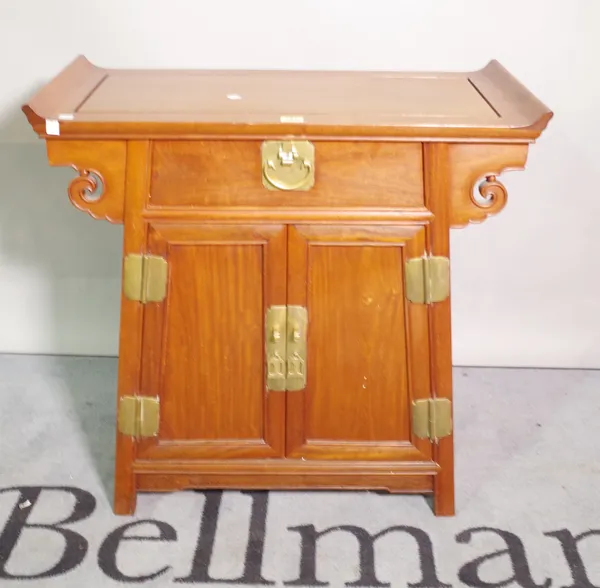 A 20th century Chinese hardwood alter table with cupboard base, 73cm wide x 73cm high.