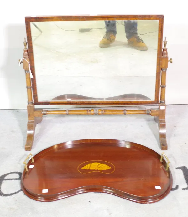 A Victorian mahogany framed toilet mirror, 65cm wide x 32cm high and a mahogany kidney shaped galleried tray, with inlaid conical shell, 64cm wide, (2