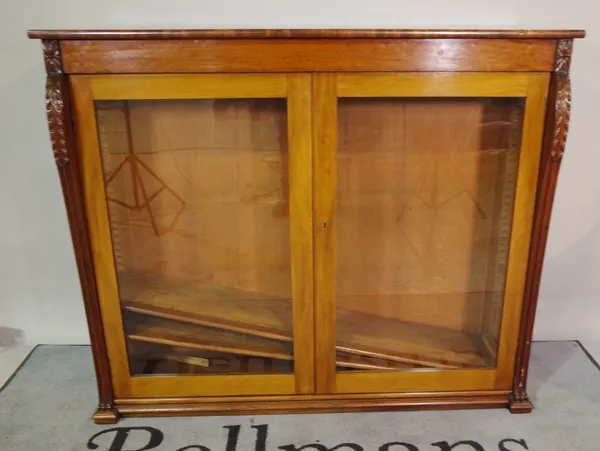 A Victorian mahogany bookcase, with acanthus moulded glass doors, on a plinth base, 136cm wide x 114cm high.