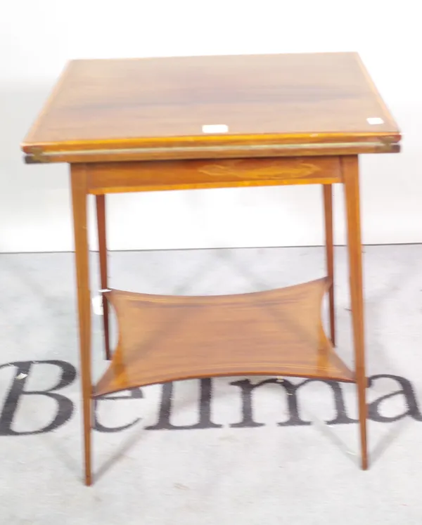 An Edwardian mahogany satinwood banded two tier folding games table, 53cm wide x 72cm high and an Edwardian mahogany drop flap side table, 61cm wide x