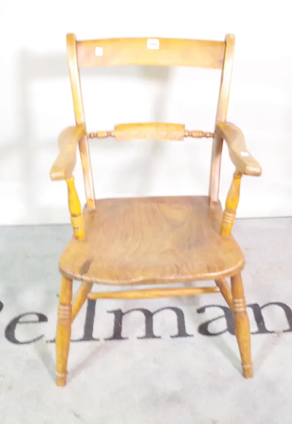 A 19th century ash and elm bar back scullery open armchair, 49cm wide x 82cm high.