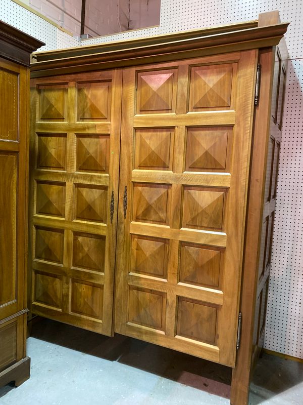 An 18th century style hardwood double wardrobe, with panelled doors.