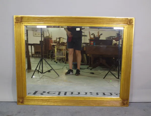 A 20th century gold painted rectangular wall mirror, with fluted edges, 121cm x 94cm high.