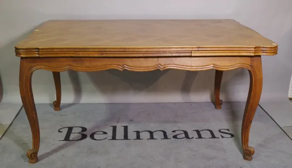 A 20th century French oak parquetry inlaid extending dining table, 150cm wide x 75cm high, 250cm fully extended.