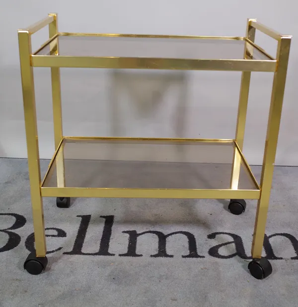 A 20th century brass and smoked glass two tier serving trolley, 64cm wide x 70cm high.