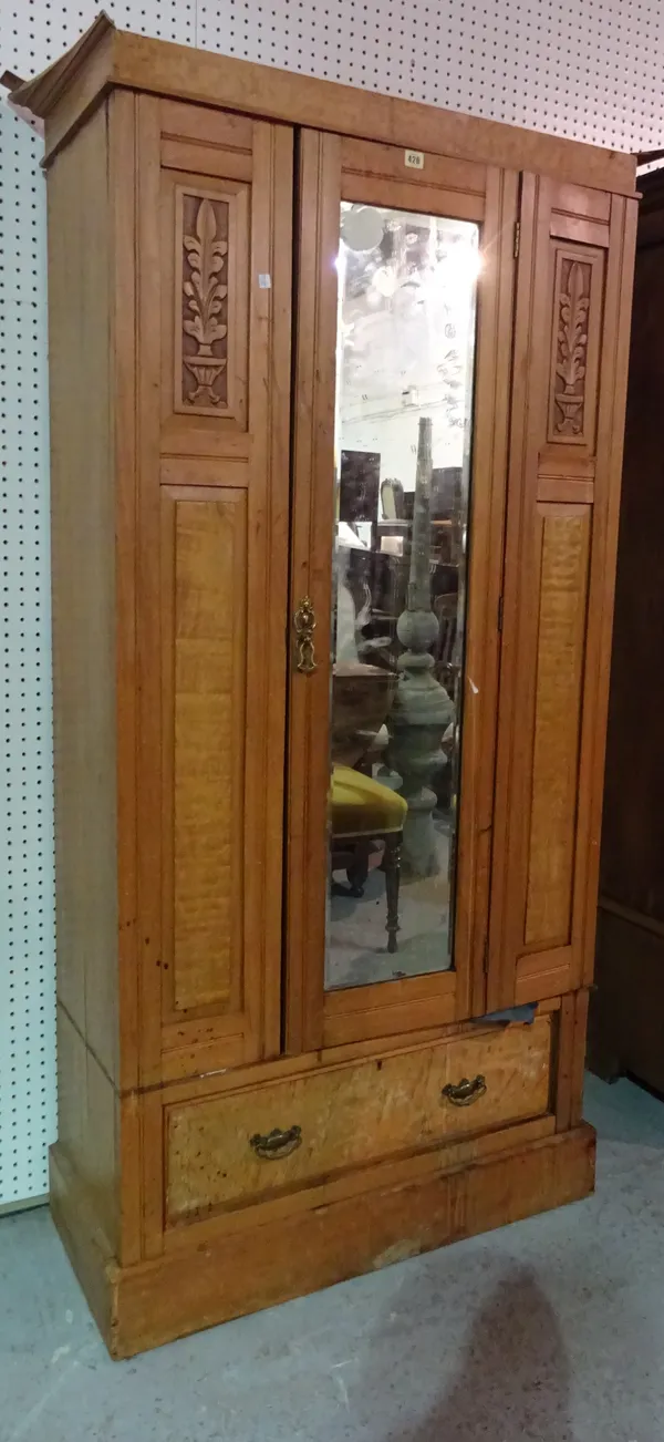 A late Victorian mahogany single wardrobe, with mirrored central door over single drawer on plinth base, 98cm wide x 182cm high.