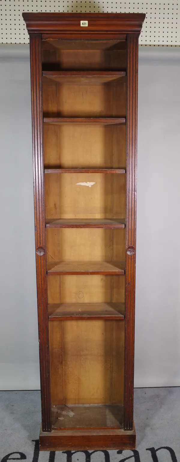 An early 20th century mahogany floor standing open bookcase, on plinth base.