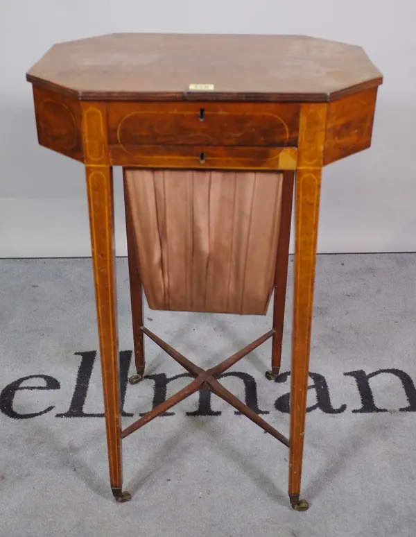 A Regency walnut octagonal sewing table, on tapering supports, united by 'X' frame stretcher, 56cm wide x 75cm high.