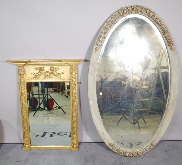 A gilt framed pier mirror, 66cm wide x 88cm high and a 20th century green painted oval mirror with bevelled glass, 80cm wide x 135cm high, (2).