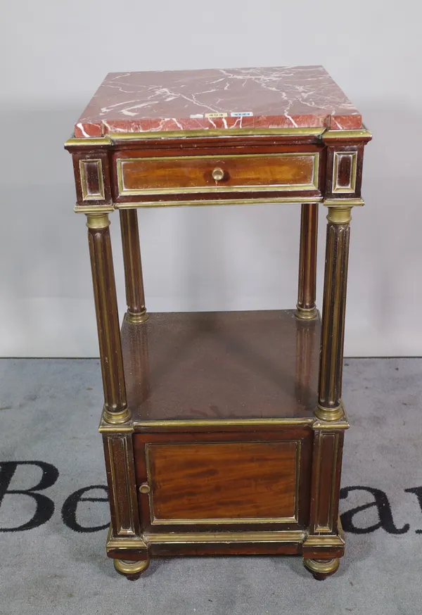 A 19th century French brass mounted mahogany bedside cabinet, the marble top over drawer and cupboard, on fluted supports, 43cm wide x 90cm high.