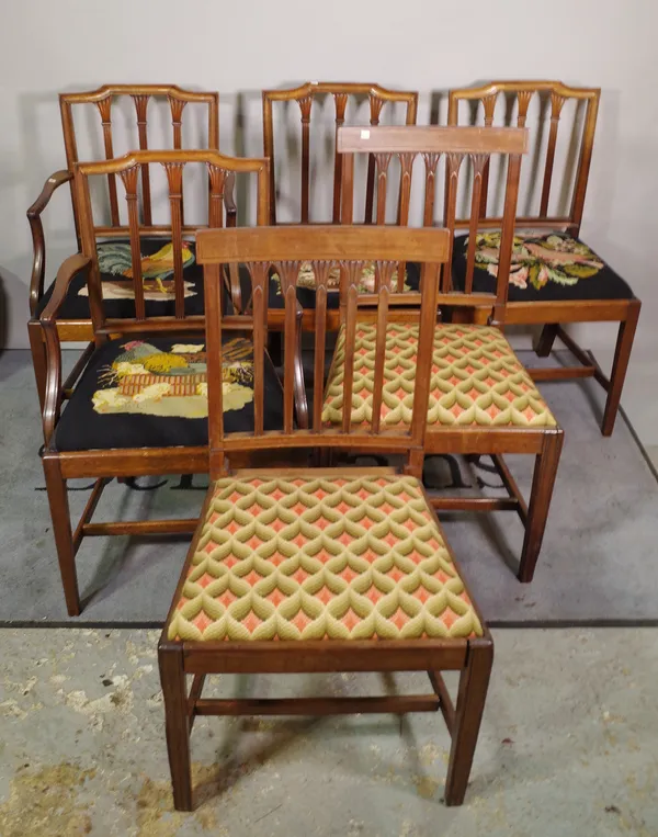 A set of six George III style mahogany dining chairs with reeded stickback on square supports, including a pair of carvers and another two similar sin