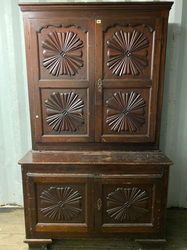 A late 18th/early 19th century Spanish oak and walnut side cabinet, with pair of double panelled doors over single panelled lower, each decorated with