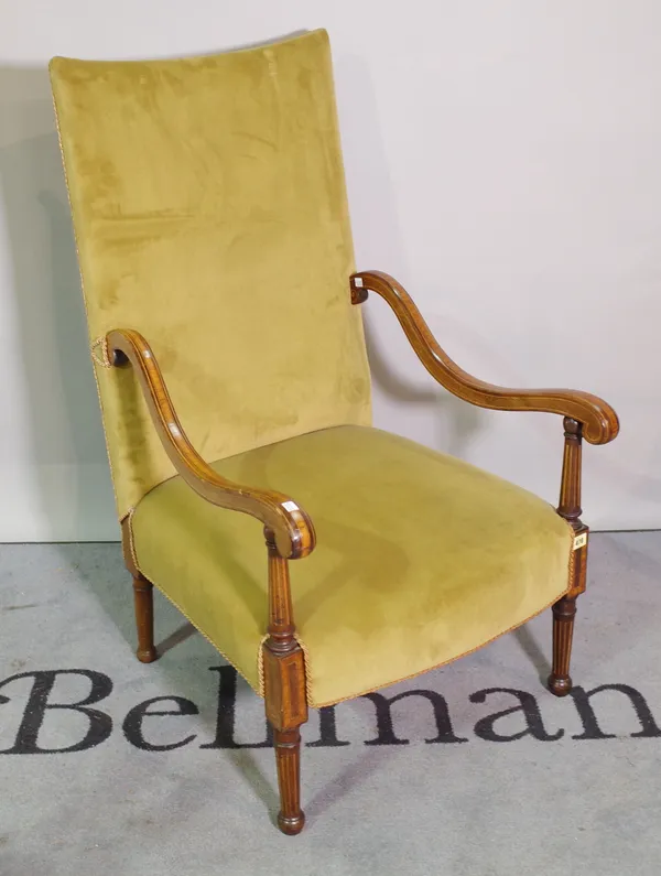 An Edwardian mahogany satinwood inlaid open armchair, with scrolling arms on tapering supports.