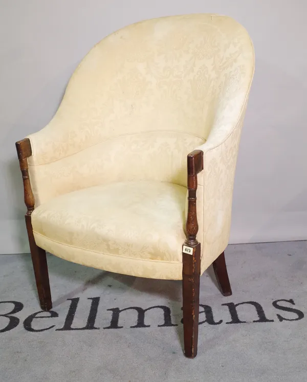 A Victorian mahogany framed high backed tub chair, on tapering square supports.