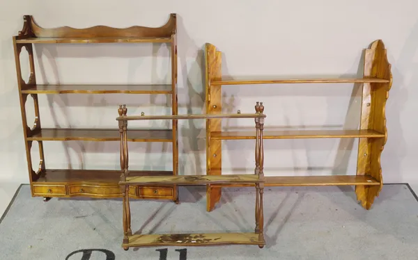 A late 19th century satin birch three tier hanging wall shelf, 79cm wide x 82cm high and two further 20th century mahogany three tier hanging shelves,