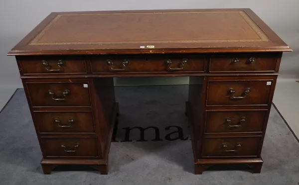 A 20th century pedestal desk with gilt tooled leather top and nine drawers about the knee, 122cm x 78cm.