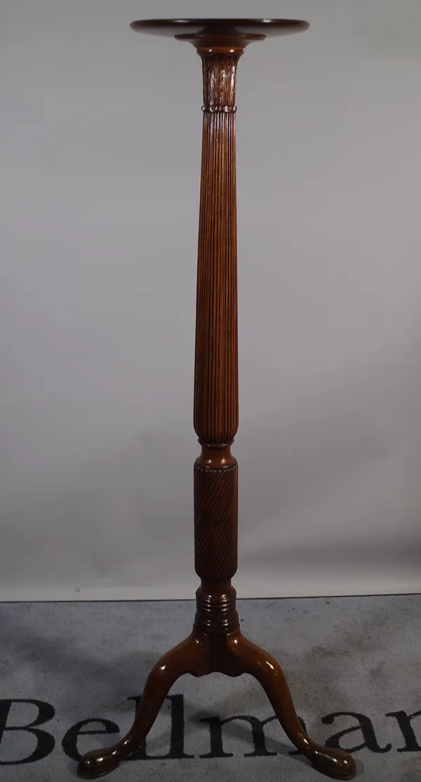 A Regency style mahogany jardiniere stand with dished circular top on fluted column and three downswept supports on pad feet, 33cm diameter x 152cm hi