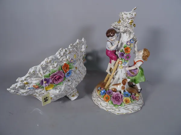 A Plaue porcelain centrepiece, 20th century modelled as a boy and girl with dog picking apples, beneath a flower encrusted and pierced bowl, blue prin