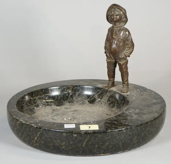 A 20th century bronze figure of a child, mounted on a dished granite base, 23cm high x 30cm wide.