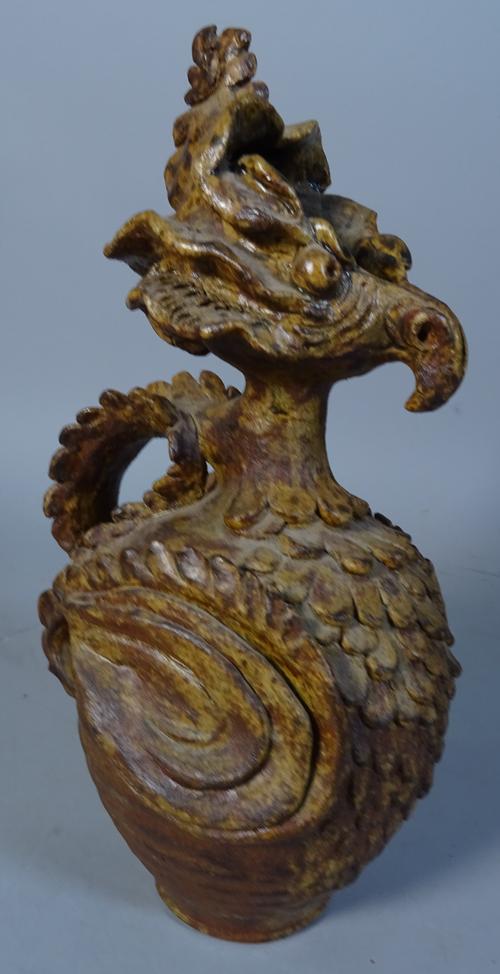 Ray Marshall (1913-1986) a stoneware phoenix jug, thrown and modified form with a yellow glaze, inscribed signature, pre 1952, 29cm high.  ARR