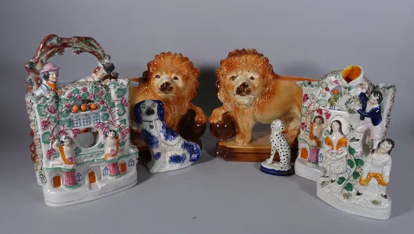Ceramics including; a group of four Staffordshire flatback figures, a pair of lions and two dogs, (8).