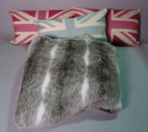 A group of interior soft furnishing items, comprising; a faux grey fur throw and three Laura Ashley needlework cushions, depicting Union Jacks two in