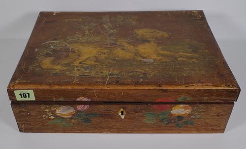 A French painted fruitwood rectangular sewing box, 19th century, the hinged lid painted with a dog, opening to reveal a green painted fitted interior