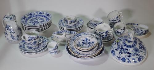 A composite group of blue and white `Onion' pattern porcelain and pottery, late 19th/ 20th century, Meissen and other factories, including a coffee po
