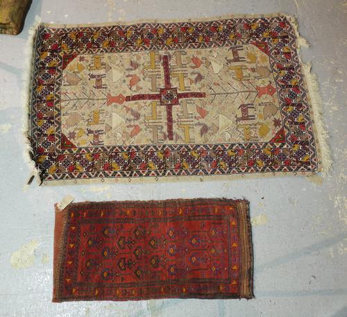 A North African chain stitch rug with animals, 190cm x 120cm, and a South Persian bag, 120cm x 58cm. (2)