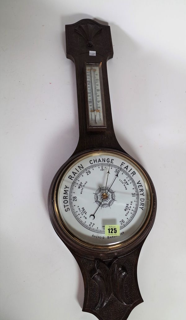 An early 20th century oak aneroid wall barometer, 69cm high. S2B