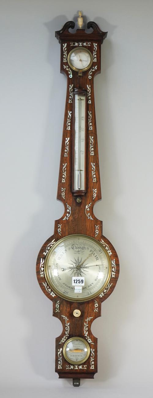 A rosewood and mother-of-pearl inlaid wheel barometer, 19th century, with broken arch pediment, dry/damp detector, thermometer, 6 inch dial, detailed